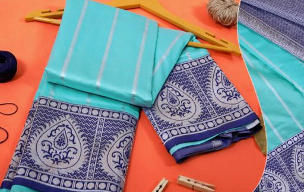 Sky and Blue Silver Design Swastika Dola Silk Saree